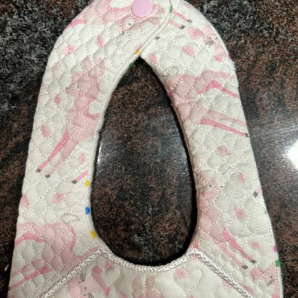 Handmade reversible quilted baby bib in pink deer print